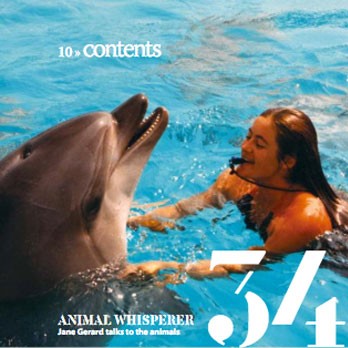 Jane Gerard’s Animal Whisperer Feature Jane Gerard interacting with a dolphin in a pool, showcasing animal communication skills.